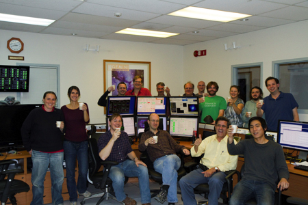 Photo of the members of the GPI team celebrating with a toast after a successful run of GPI integration with the Gemini South telescope.