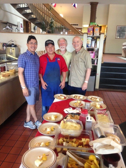 Picture of Bill (right) and Steve (second from right) with Hale Pohaku cook Jason Hashimoto (second from left) as they prepare food for observatory staff at the Mauna Kea mid-level facilities. Also shown is Charlie Fabella (left).