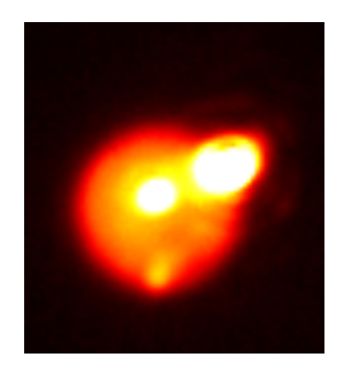 Image of Io taken in the near-infrared with adaptive optics at the Gemini North telescope on August 29. In addition to the extremely bright eruption on the upper right limb of the satellite, the lava lake Loki is visible in the middle of Io’s disk, as well as the fading eruption that was detected earlier in the month by de Pater on the southern (bottom) limb. Io is about one arcsecond across. Image credit: Katherine de Kleer/UC Berkeley/Gemini 