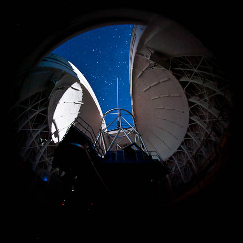 Photo of the interior view of the Gemini South during propagation of the laser guide star system during on-sky testing of the laser system.