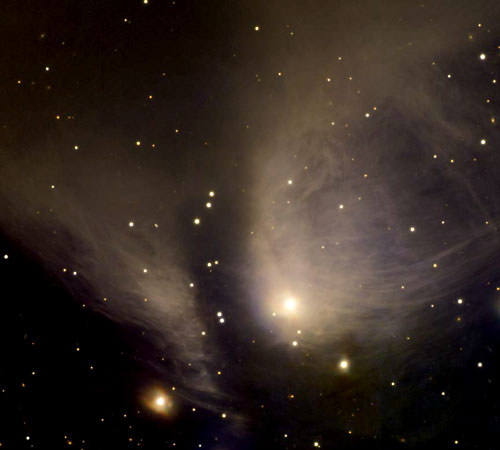 Image of a stellar nursery called RY Tau. The image shows wispy gas clouds surrounding a bright central star. The central star's brightness varies irregularly.