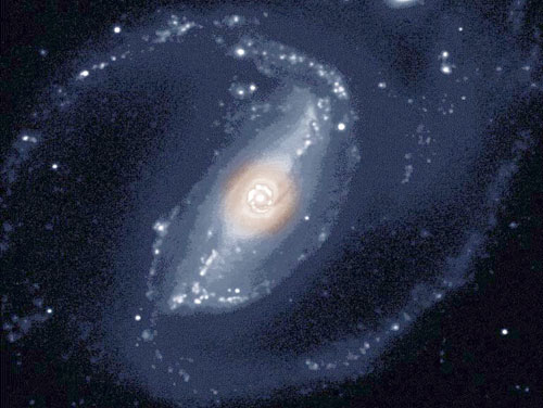 Active galaxy NGC 1097, 47 million light-years away, with an expanded ring structure around the central region.