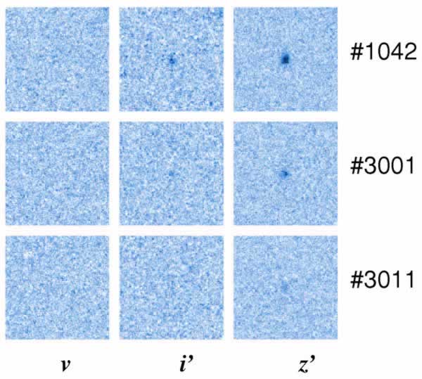 This image shows three postage stamp-sized views (each 3 arcseconds wide) of faint, high-redshift galaxies discovered by the GLARE team. The panels show the same galaxies observed through different filters (v, i', and z').