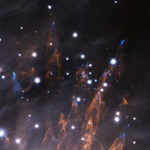 Gemini South telescope image with adaptive optics reveals detailed structures in Orion Nebula (blue: iron gas, orange: hot hydrogen, white: background stars).