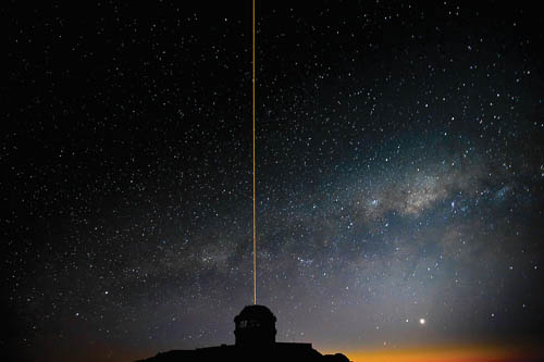 Picture of the Gemini South laser propagating into the night sky as the Milky Way rises in the background.