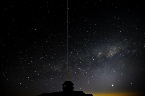 Picture of the Gemini South telescope during laser operations.