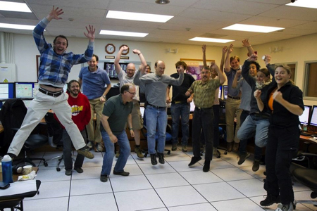 Photo of the member of the GPI integration team celebrating after obtaining first light images at the Gemini South telescope control room in Chile.