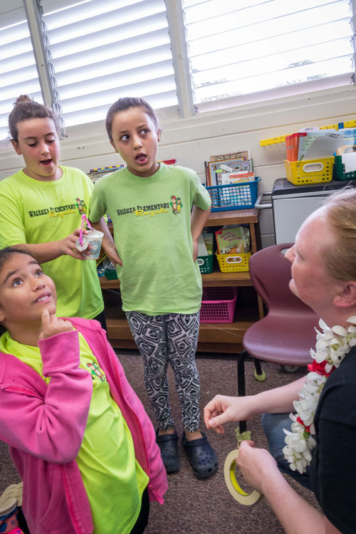 Picture of Gemini Software Engineer Angelic Ebbers interacting with a group of children.