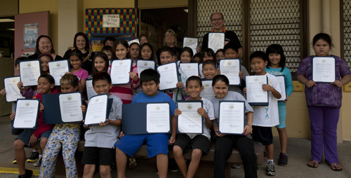 Photo of Gemini/NSF's Scott Fisher (back, tallest!) displaying individual proclamations from Hawaii's Governor Neil Abercrombie for Journey Through the Universe.