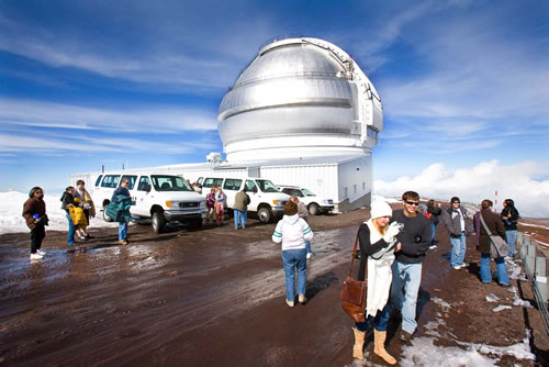 Photo of Gemini North staff family tour participants get ready to enter the facility on the snowy heights of Mauna Kea.